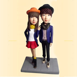 Couple lifelike clay figurines
