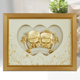 Gold foil portrait of the double happiness doll