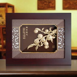 Gold foil ornaments of peaches and plums