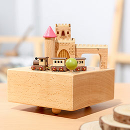 Wooden castle rotating music box