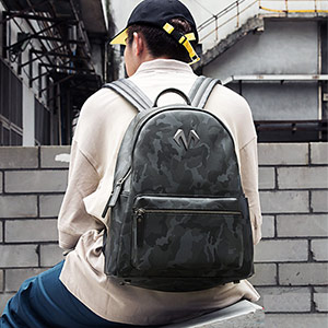 Young trendy men's camouflage backpack