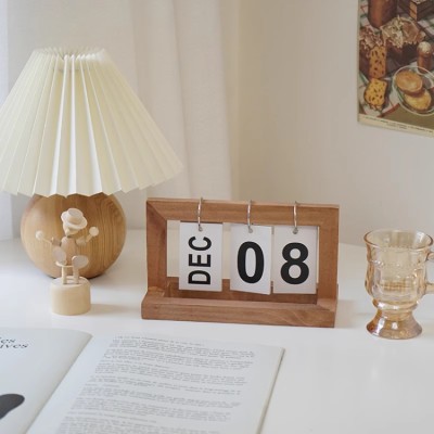 Creative page-turning wooden calendar