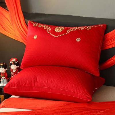 A pair of red wedding pillows