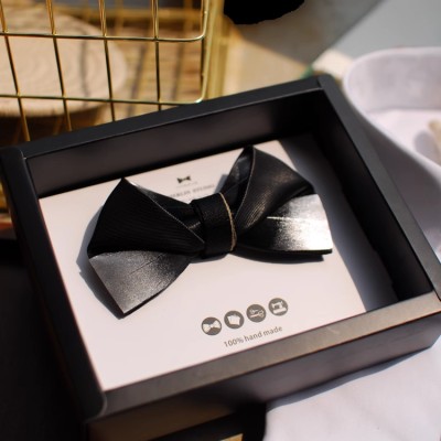 Black and white star patchwork feather bow tie